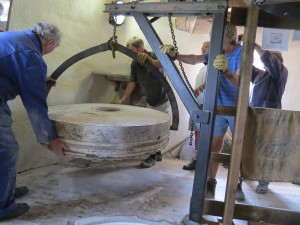 The runner stone is lifted clear using the scissor grip crane