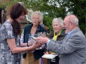 Sue Colclough receiving the Margaret Bonsall Art Challenge Trophy from judge Bryan Bonsall with Freda Stallerbrass and fellow judge Doreen Andrews looking on
