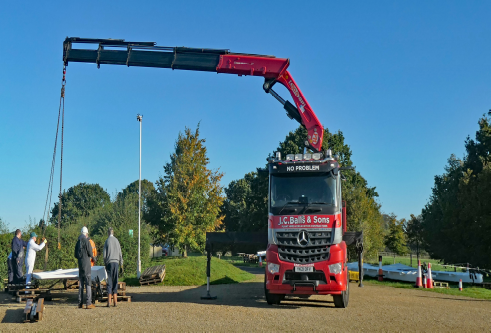 Crane positioning to lift the sail